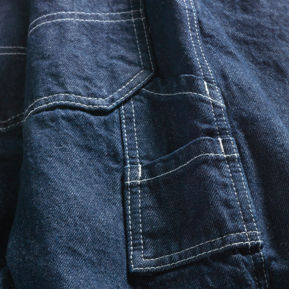Close up to tool pocket on Deadstock denim cropped carpenter pant in indigo with Ginew tag