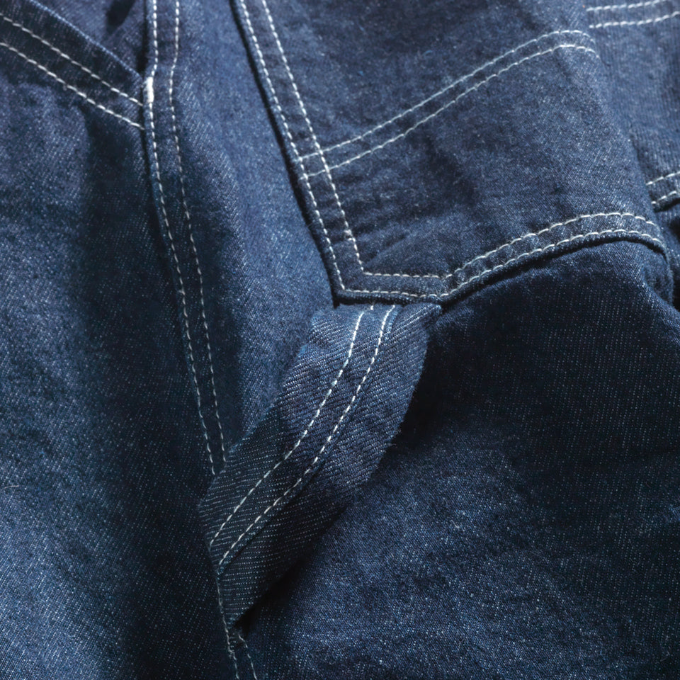 Cloos up of tool loop on Deadstock denim cropped carpenter pant in indigo with Ginew tag