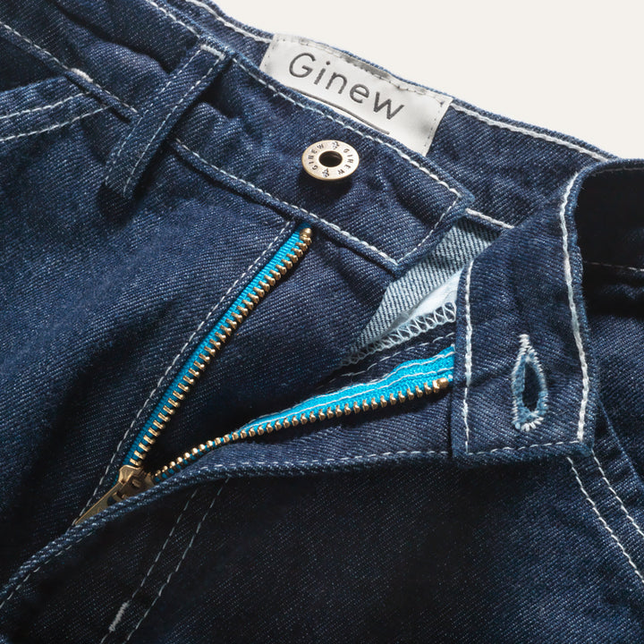 Close up of zipper on Deadstock denim cropped carpenter pant in indigo with Ginew tag