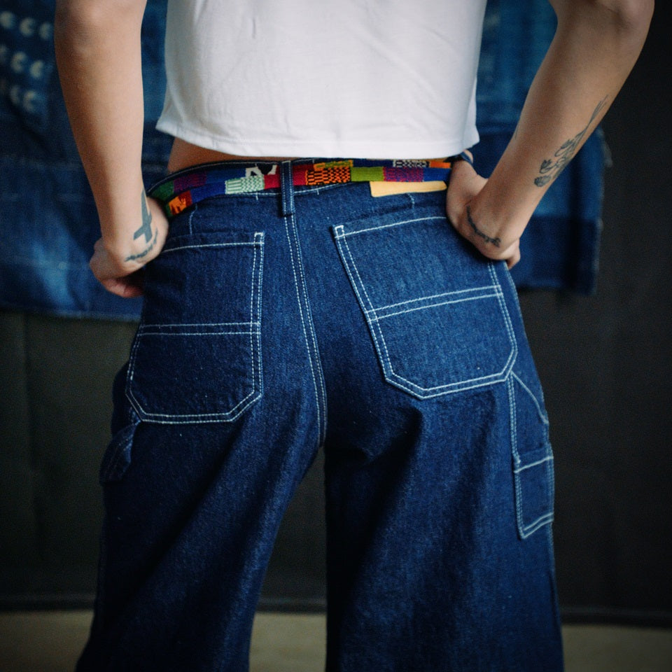 Back view of cropped indigo carpenter pants