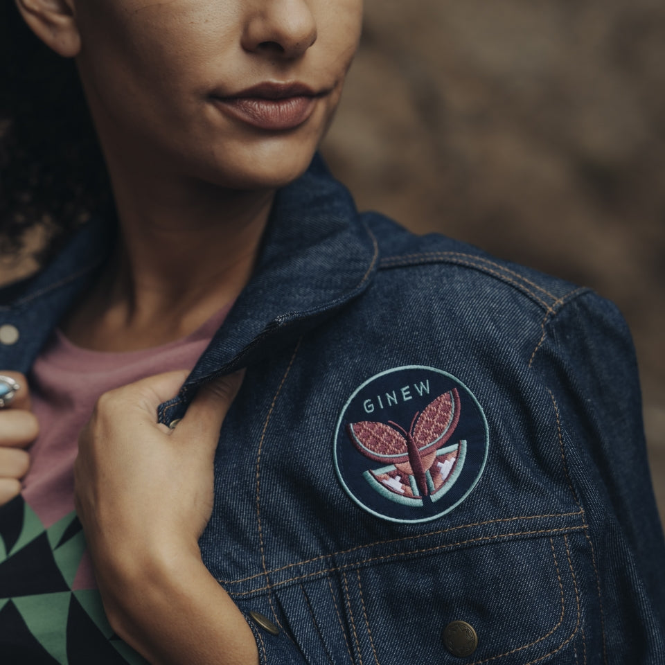 Butterfly patch on raw denim jacket
