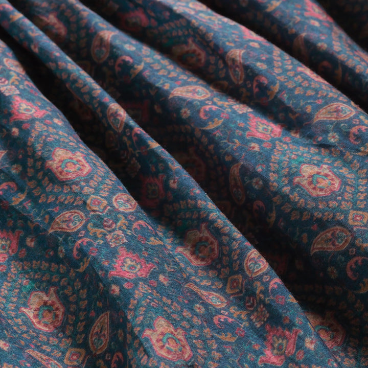 Close up of shirt paisley design on Short sleeve women's teal shirt with dusty pink flowers and paisley design