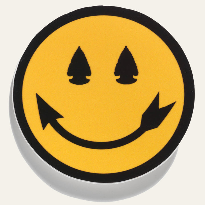 Native American designed smiley face sticker with arrowhead eyes and smile. Designed by Steven Paul Judd.