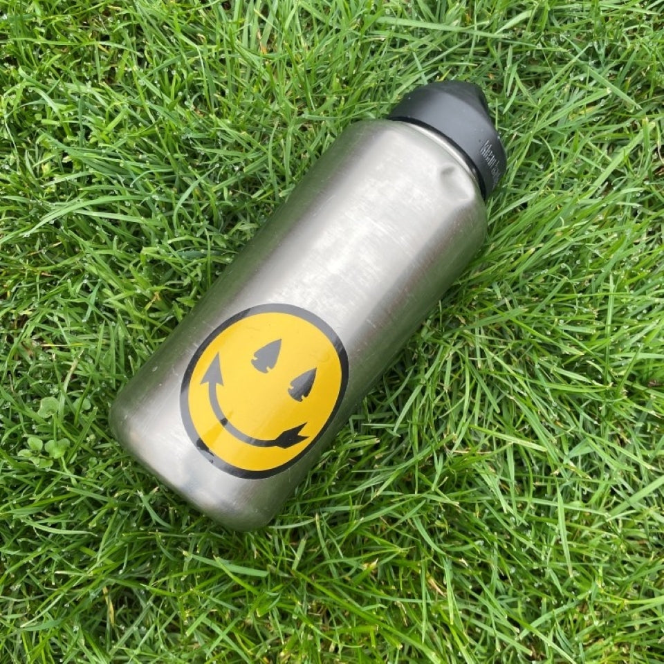 Smiling arrow sticker on water bottle