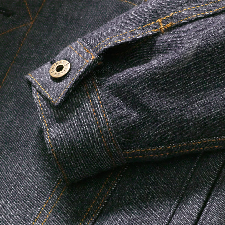 Selvedge denim lined yellow coat with inside tag of Ginew Made in USA.