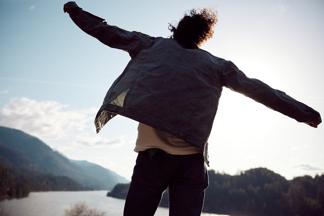 Man wearing Native American Ginew looking at horizon