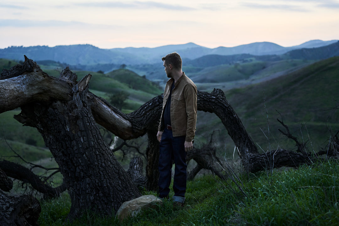 Man wearing Native American Ginew looking at horizon