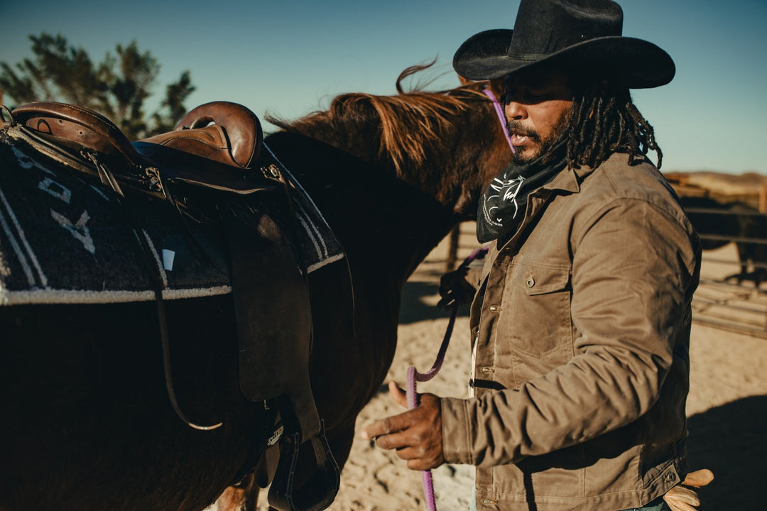 Brown wax canvas coat made in USA by Native American Indigenous Ginew worn on rancher