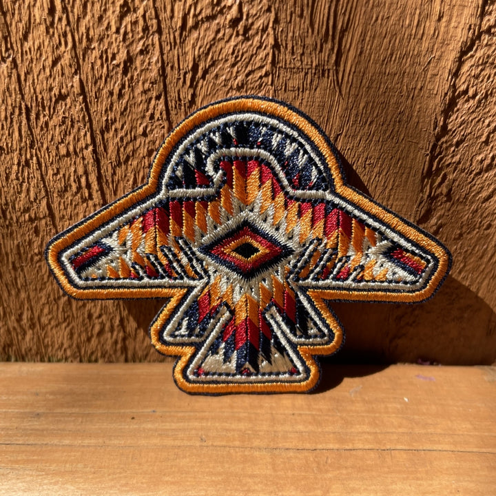 Orange, red, white Indigenous  thunderbird patch 