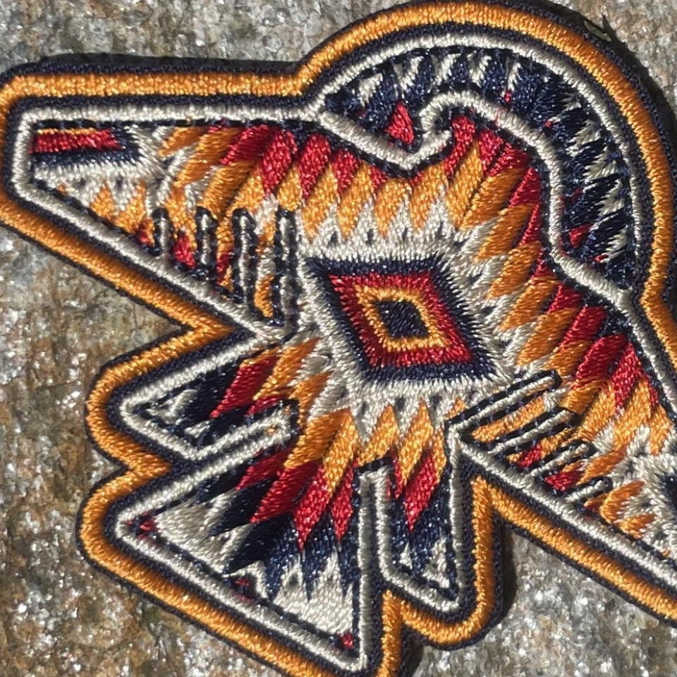Orange, red, white Indigenous  thunderbird patch 