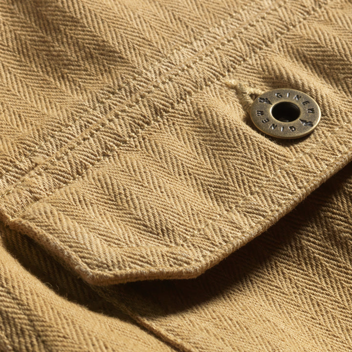 Close up of pocket on tan saddle color cotton barn jacket male and female all gender with four pockets by Ginew