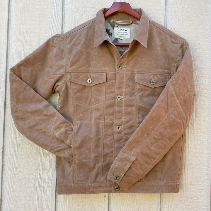 Front of Brown wax canvas rider coat lined in Native American brown and cream wool made by Indigenous owned Ginew