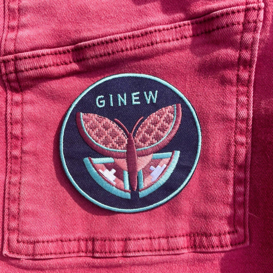 Ginew butterfly patch in green and burgundy on maroon denim