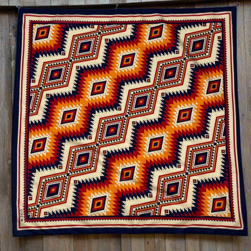 Native American Indigenous Ginew orange, yellow blue scarf wild rag made in USA hanging on fence 