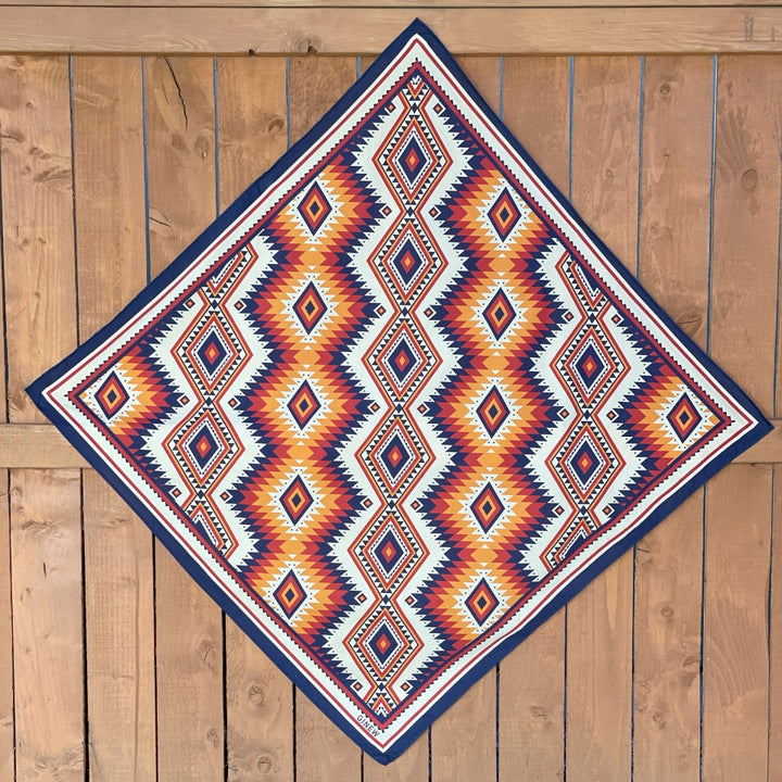 Ginew's Blue, orange, create yellow wild rag made of cotton hanging on fence