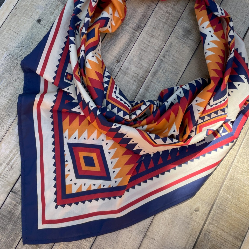 Colorful patterned scarf on a wooden surface