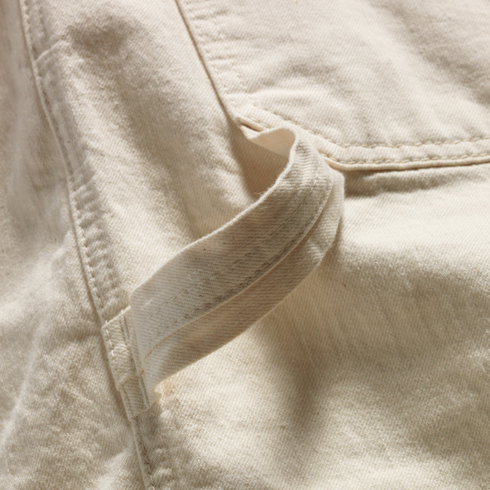 Close up of loop on Cream cotton cropped carpenter pants created by Native American Ginew