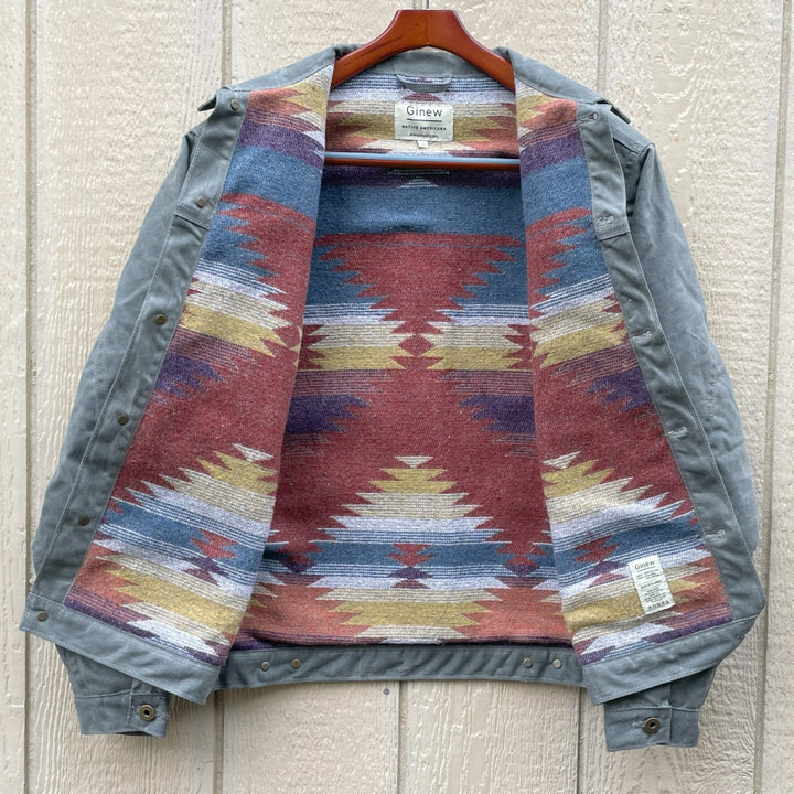 Front view on Gray silver charcoal wool lined coat with a colorful Native American patterned lining by Ginew