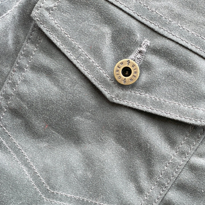 Pocket on Charcoal grey rider coat lined with colorful wool lining