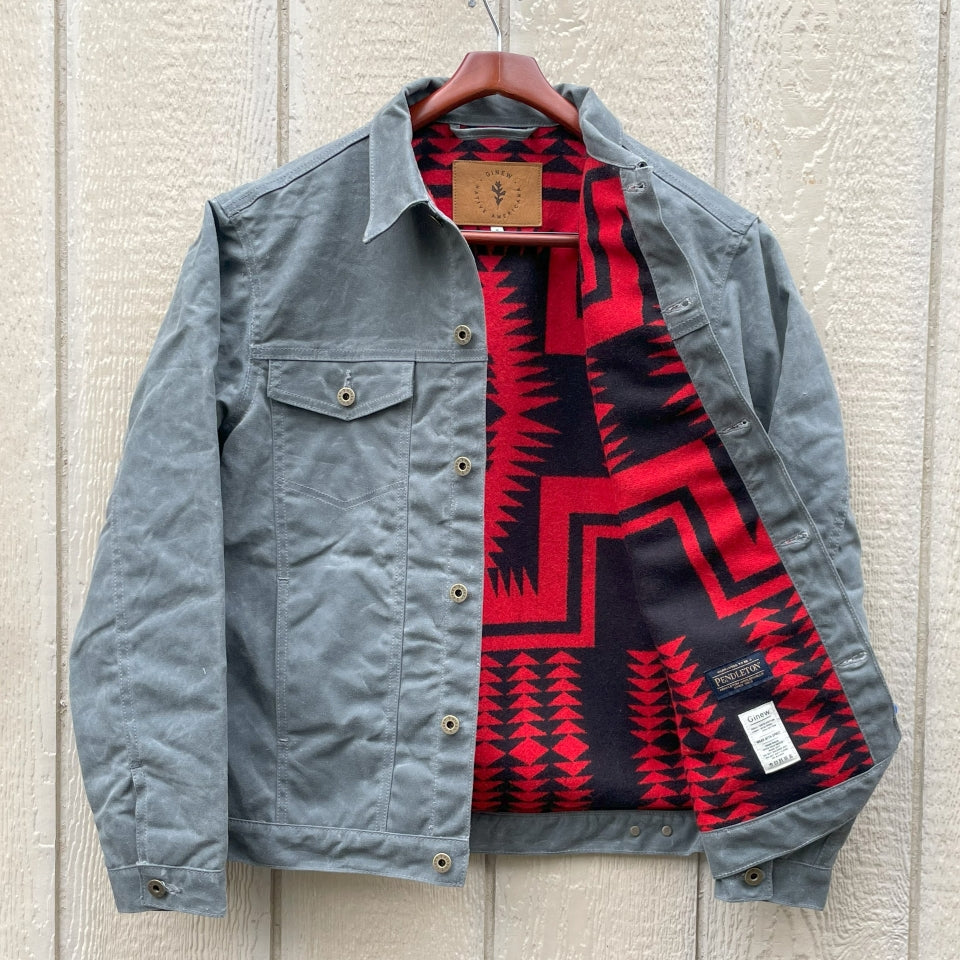 Charcoal grey rider coat lined with red and black Pendleton Walking Rock blanket lining 