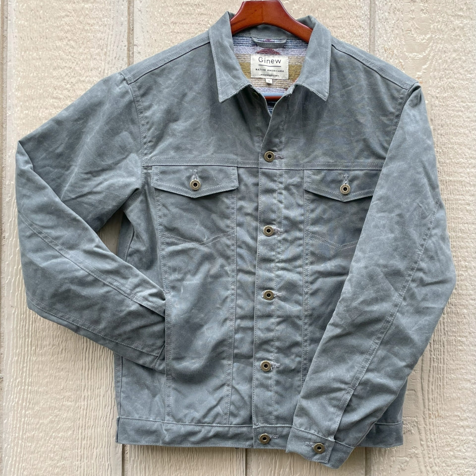 Front of Gray silver charcoal wool lined coat with a colorful Native American patterned lining by Ginew