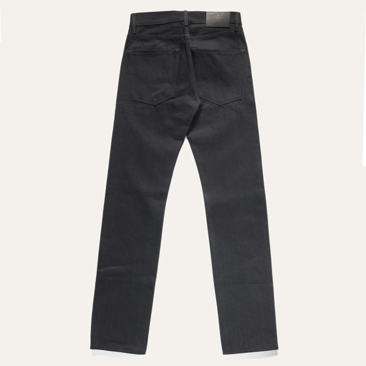 Back view of Black Crow Wing Selvedge denim jean lay flat on a white background