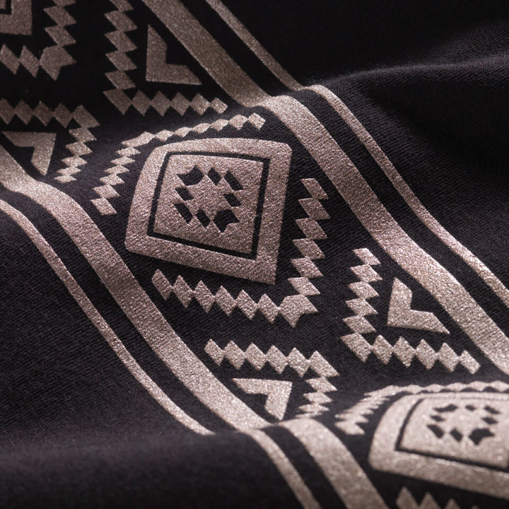 Close-up of Diamond Basket graphic printed in bronze ink on a black t-shirt.