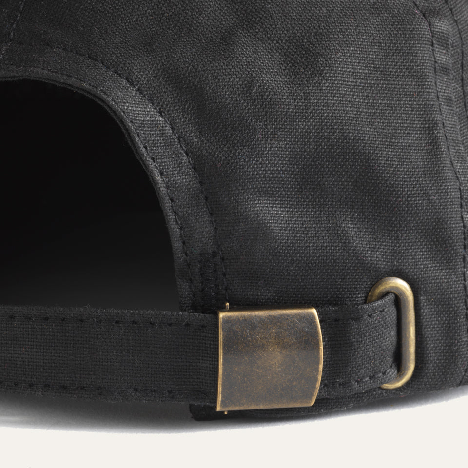 Back of black Ginew black wax canvas hat made in USA with metal clasp