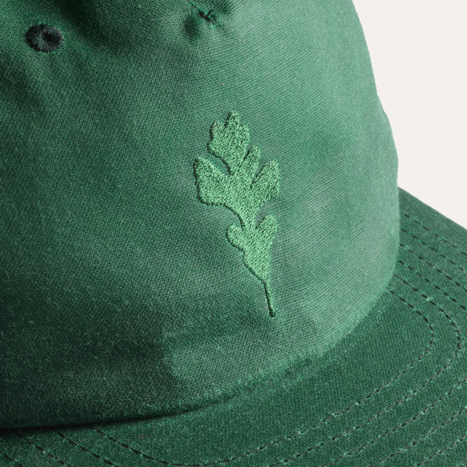 Close up of green wax canvas hat made in USA