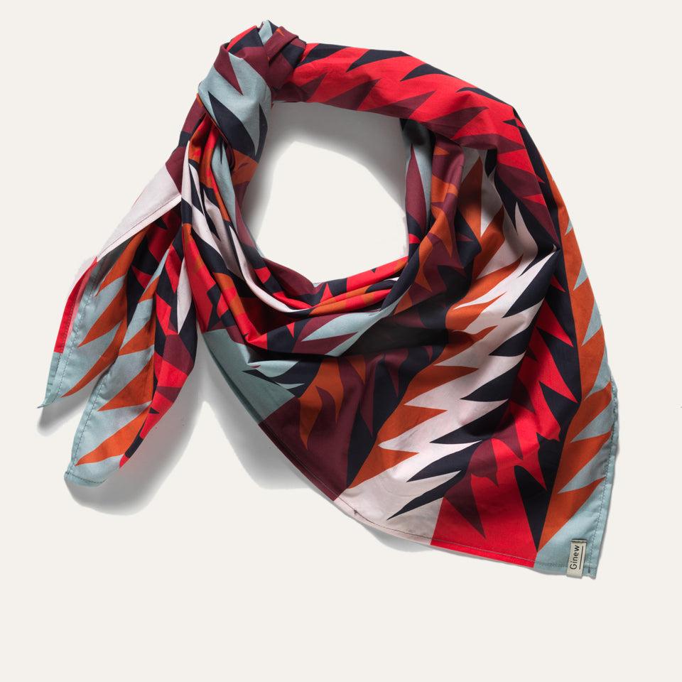 Native American designed wild rag bandana in red, blue, black and orange with Ginew tag