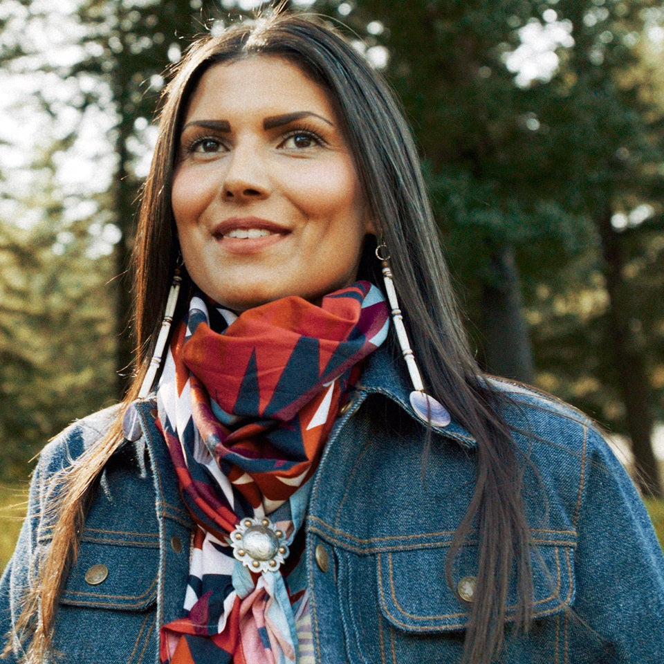 Native American model wearing all cotton wild rag bandana in red black white and blue