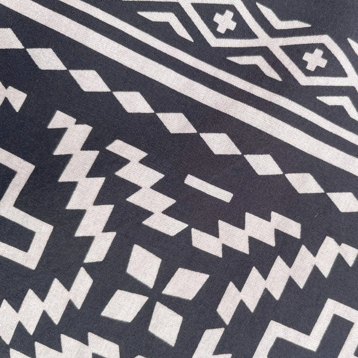 Close up of Native American Indigenous designed black and white cotton bandana by Ginew + Kassie Kussman 