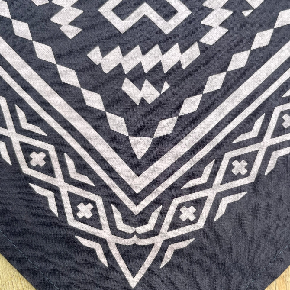 Material close up on Corner of Native American Indigenous designed black and white cotton bandana by Ginew + Kassie Kussman 