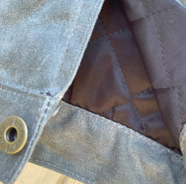 Arm quilting on Gray silver charcoal wool lined coat with a colorful Native American patterned lining by Ginew