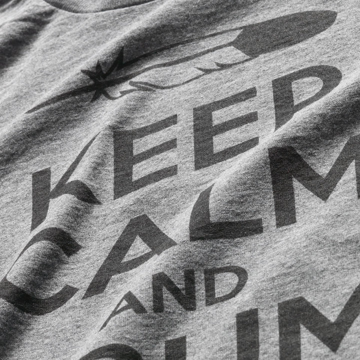 Close up of Keep Calm and Drum on t-shirt with black text on grey tee