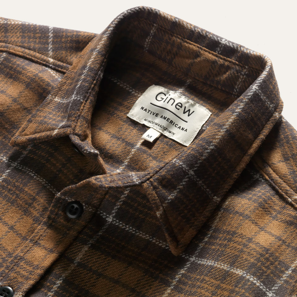 Collar close up on brown plaid wool shirt with Ginew tag