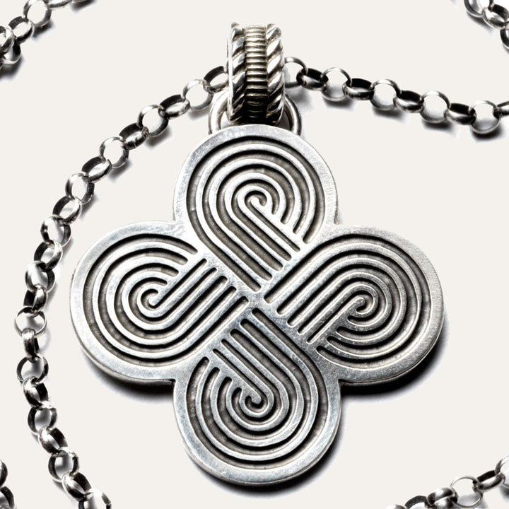 Close up of handmade silver necklace with four loop design made in USA