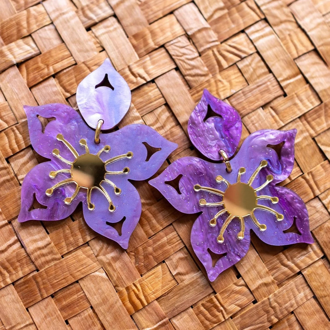 Purple salmonberry earrings made by Native American women 