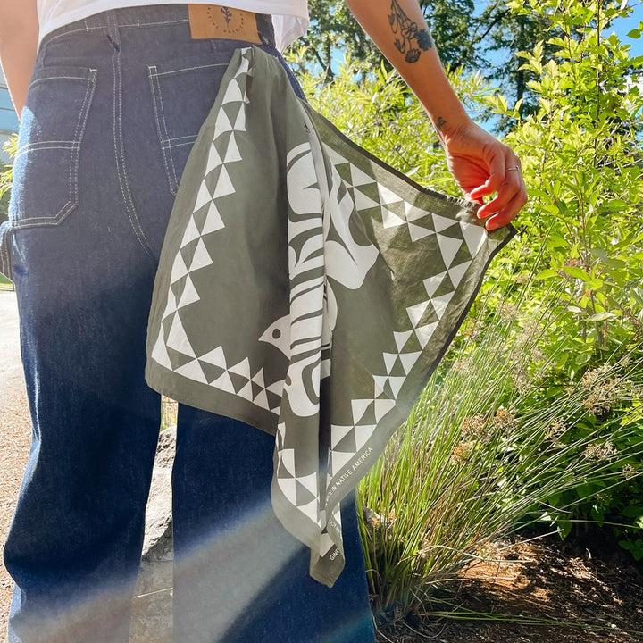 Denim cropped carpenter pants with green and cream raven bandana hanging from back pocket
