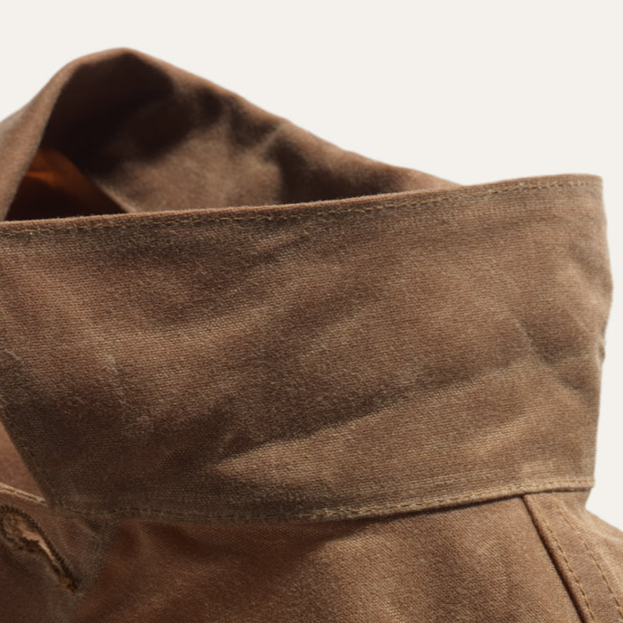 Collar of Brown wax canvas rider coat lined in Native American brown and cream wool made by Indigenous owned Ginew