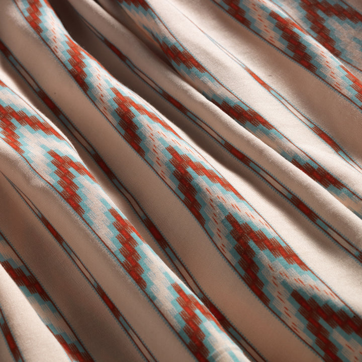 Close up of Native American Ginew Stripe Ruffle shirt  in red, turquoise blue, cream 