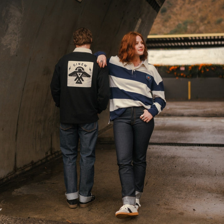 Man and woman wearing rugby shirs by Native American Ginew 