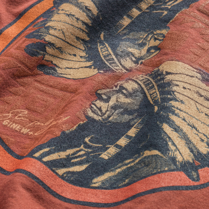 Close up of dual image of Sitting Bull on back of brick red tee designed by Steven Paul Judd