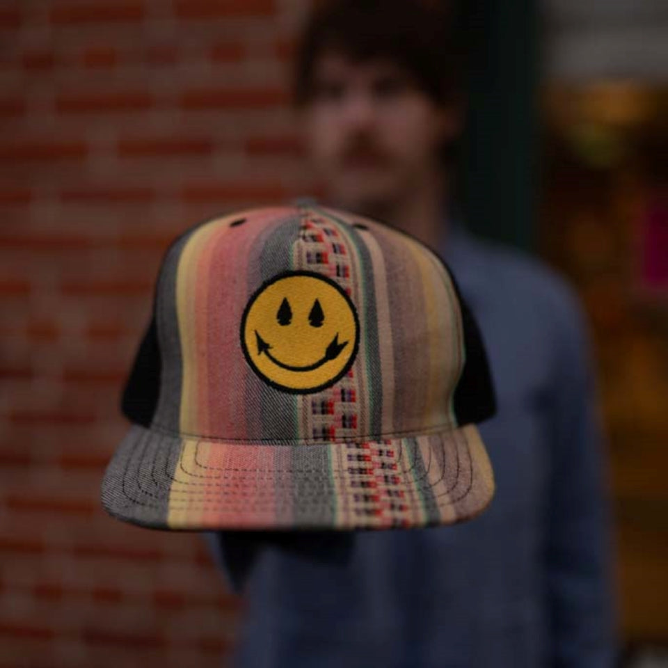 Steven Paul Judd designed colorful smiling arrow hat 