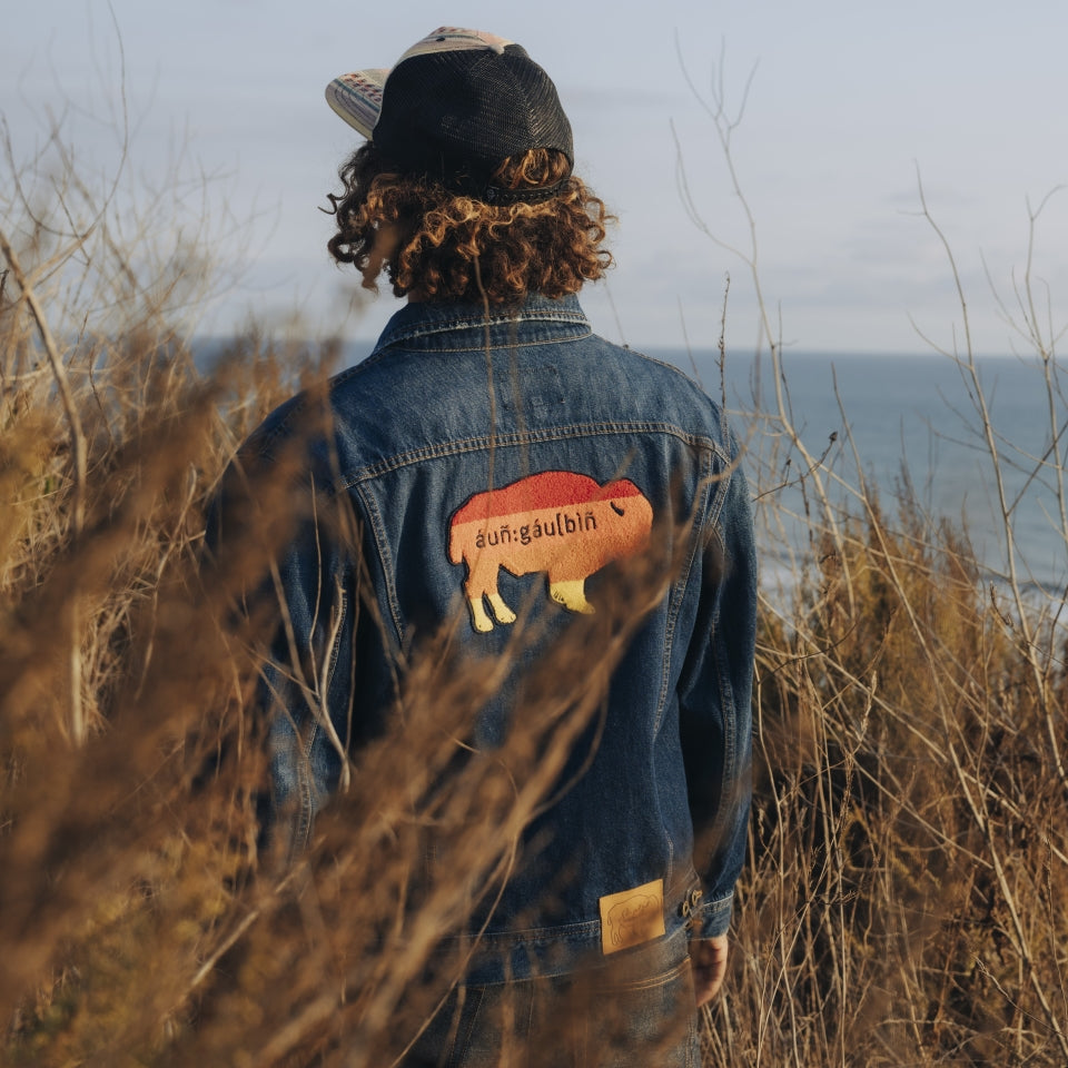 Native American Indigenous designed and made denim jacket on male on hike