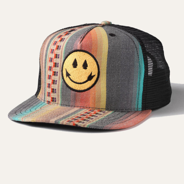 Native American Steven Paul Judd designed trucker hat with arrowhead smiley face and colorful front panel.