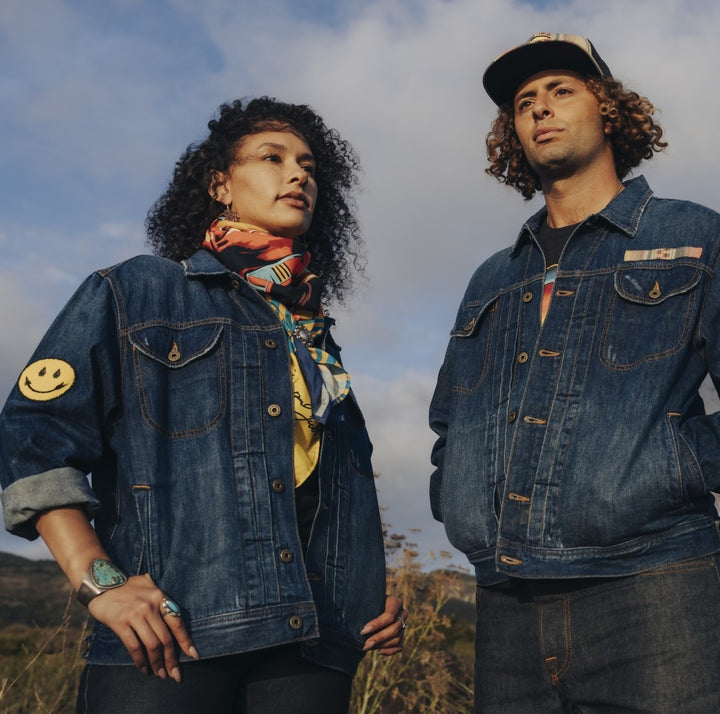 Woman and man wearing distress deadstock denim jacket customized by Steven Paul Judd with Native American designed patches