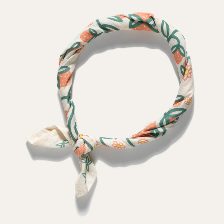 Styling option for Oneida strawberry bandana  in soft peach orange and green on cream cotton fabric