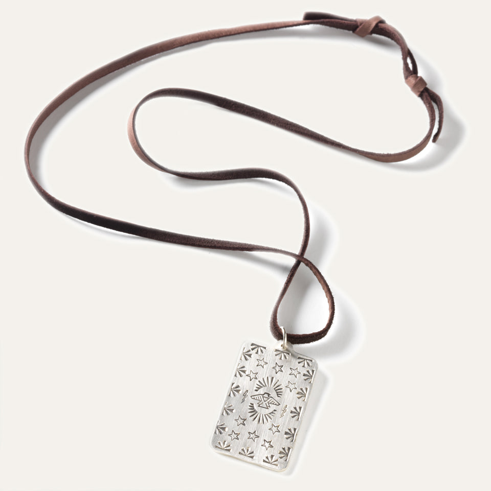 Made in USA Silver pedant tag necklace Native American made necklace with a Thunderbird design hangs on leather lace. 