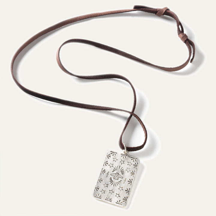 Made in USA Silver pedant tag necklace Native American made necklace with a Thunderbird design hangs on leather lace. 